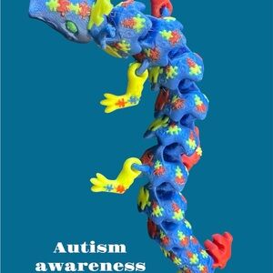 Vibrant autism awareness fidget dragon.